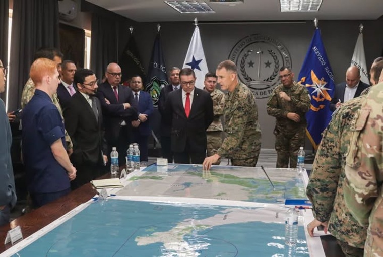 A large group of people around a map